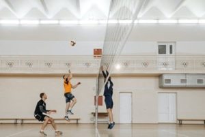a group of boys playing volleyball